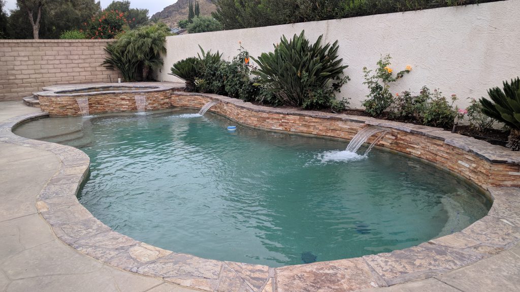 711 Bluebonnet - Pool with waterfall feature on